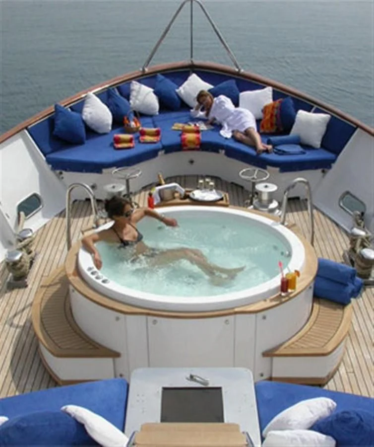 a couple of people in a swimming pool aboard AVA Yacht for Charter