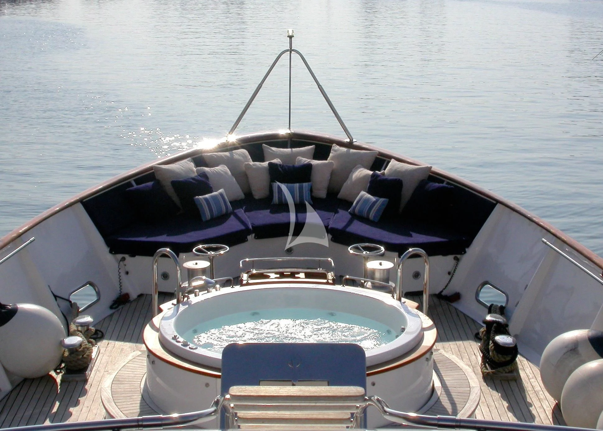 a boat with a deck and chairs on the deck aboard AVA Yacht for Charter