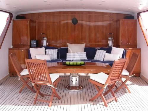 a room with a couch and chairs aboard AVA Yacht for Charter