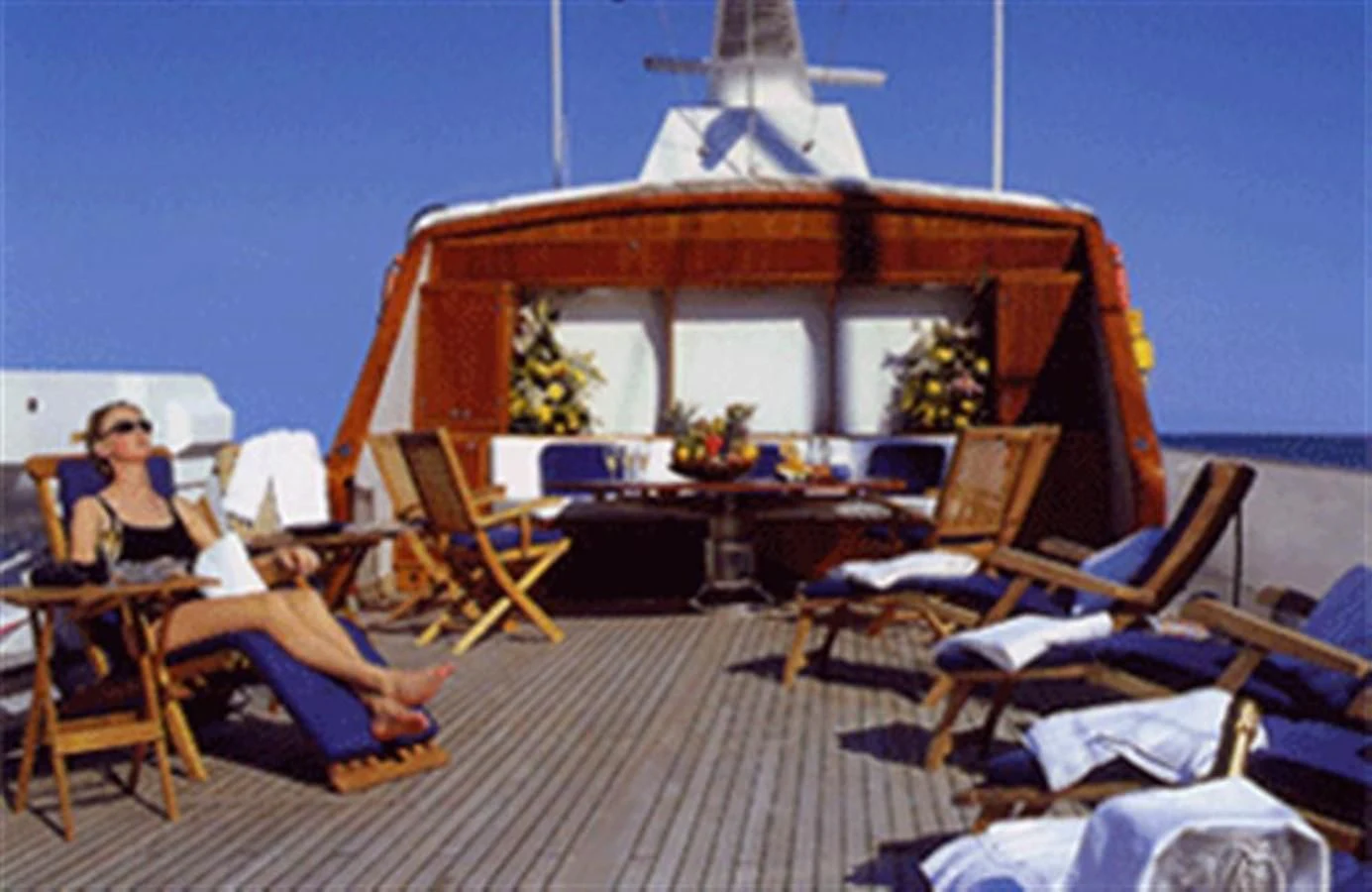 a person sitting in a lounge chair aboard AVA Yacht for Charter