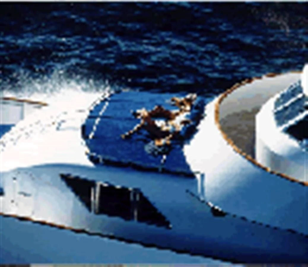 a helicopter flying over a road aboard AVA Yacht for Charter