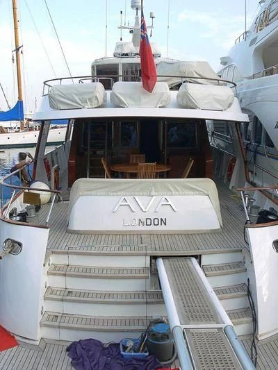 a boat with a sign on the front aboard AVA Yacht for Charter