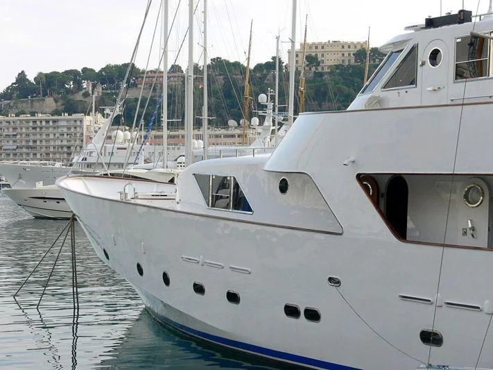 a couple of boats sit in a harbor aboard AVA Yacht for Charter