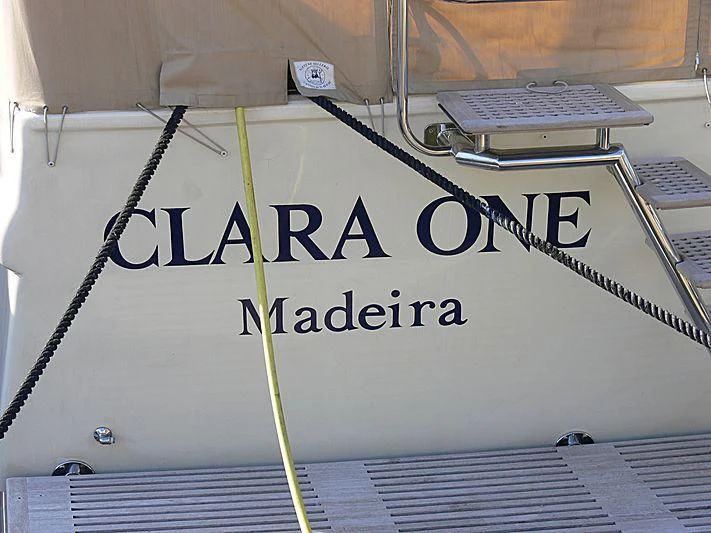 a white board with a black and white logo on it aboard CLARA ONE Yacht for Sale