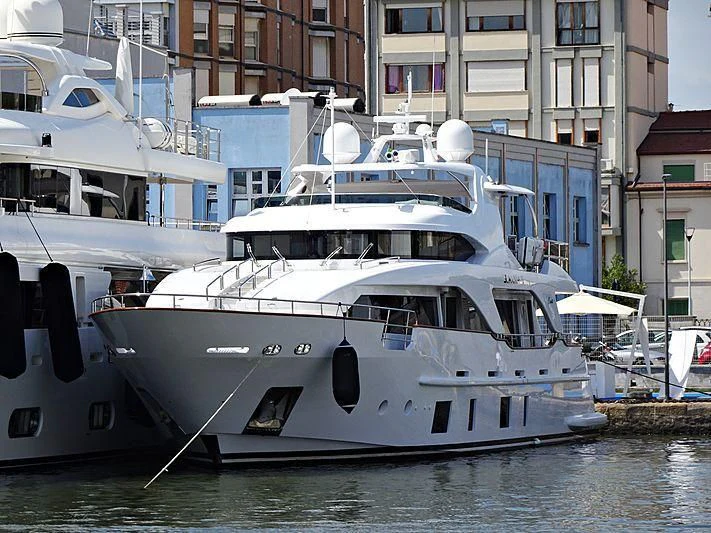 a boat docked in a harbor aboard SEA GYPSY Yacht for Sale