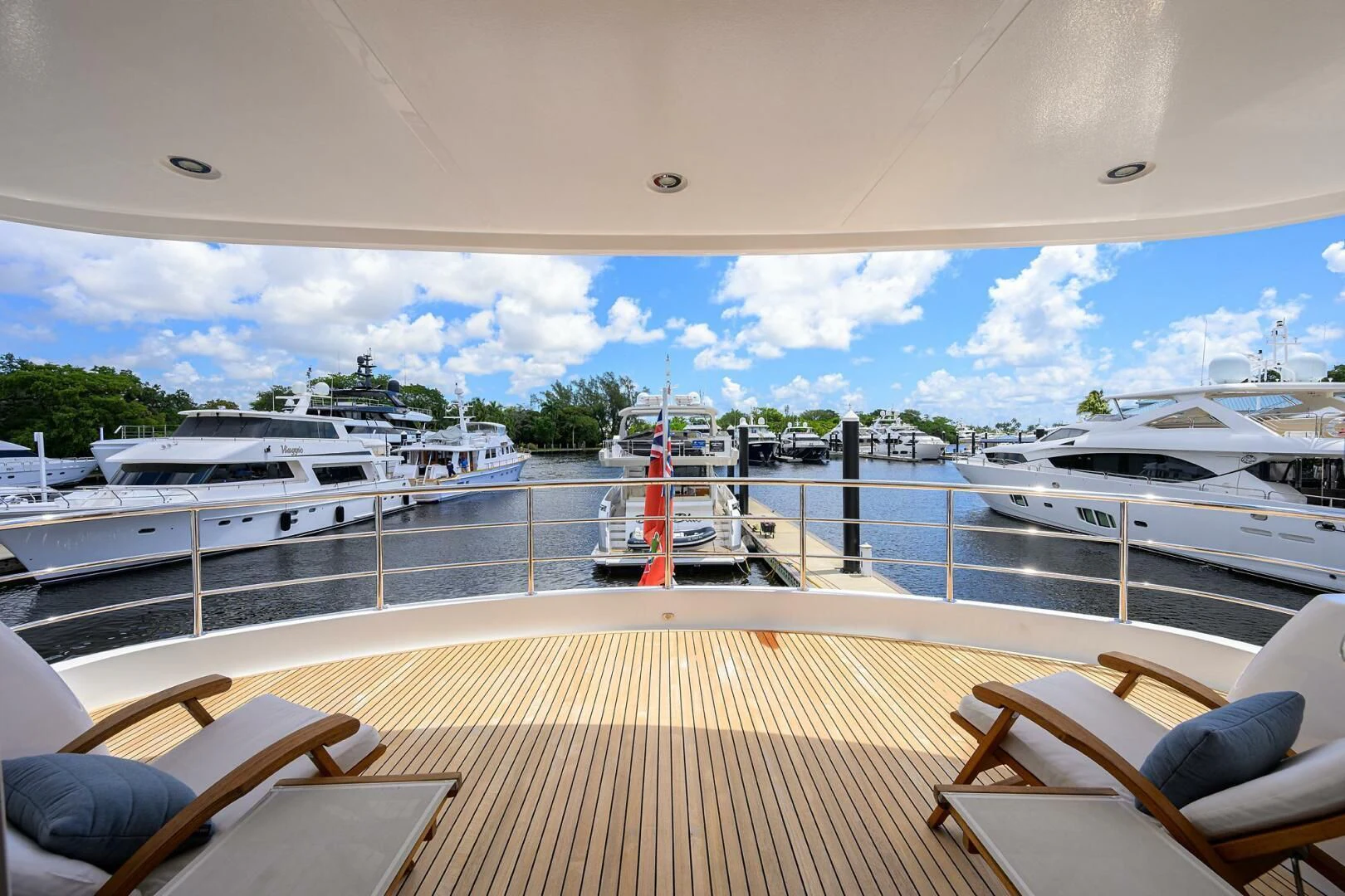 a deck with boats and chairs aboard SOLACE Yacht for Sale