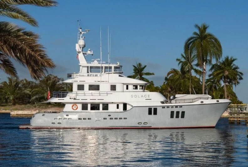a large white boat in the water aboard SOLACE Yacht for Sale