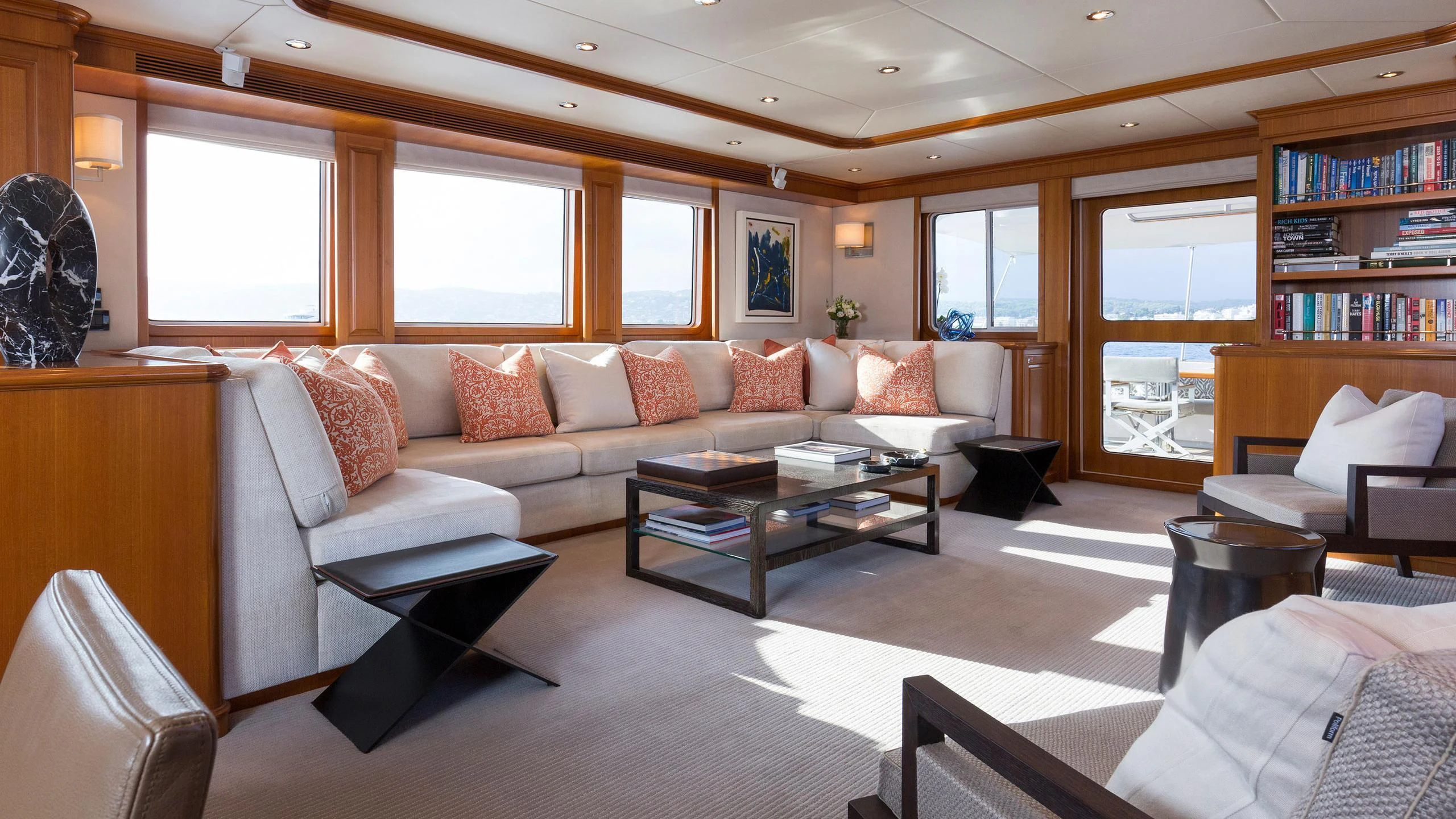 a living room with a couch and a coffee table aboard SOLACE Yacht for Sale