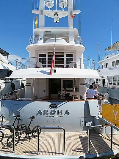 a large white boat with a red stripe on the front aboard SOLACE Yacht for Sale