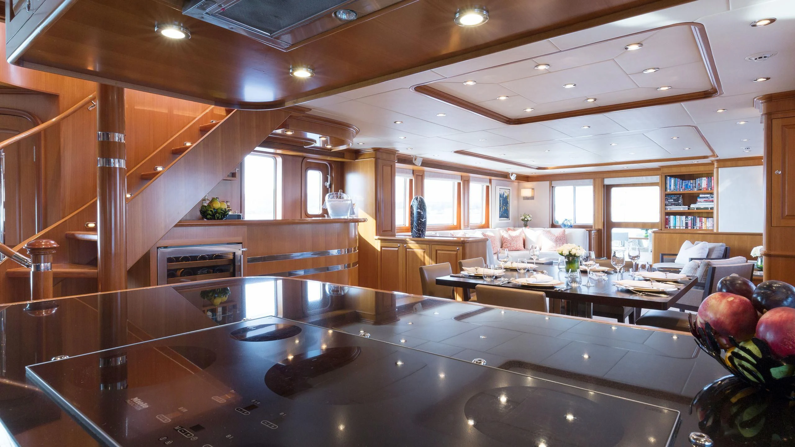 a large kitchen with a large island aboard SOLACE Yacht for Sale