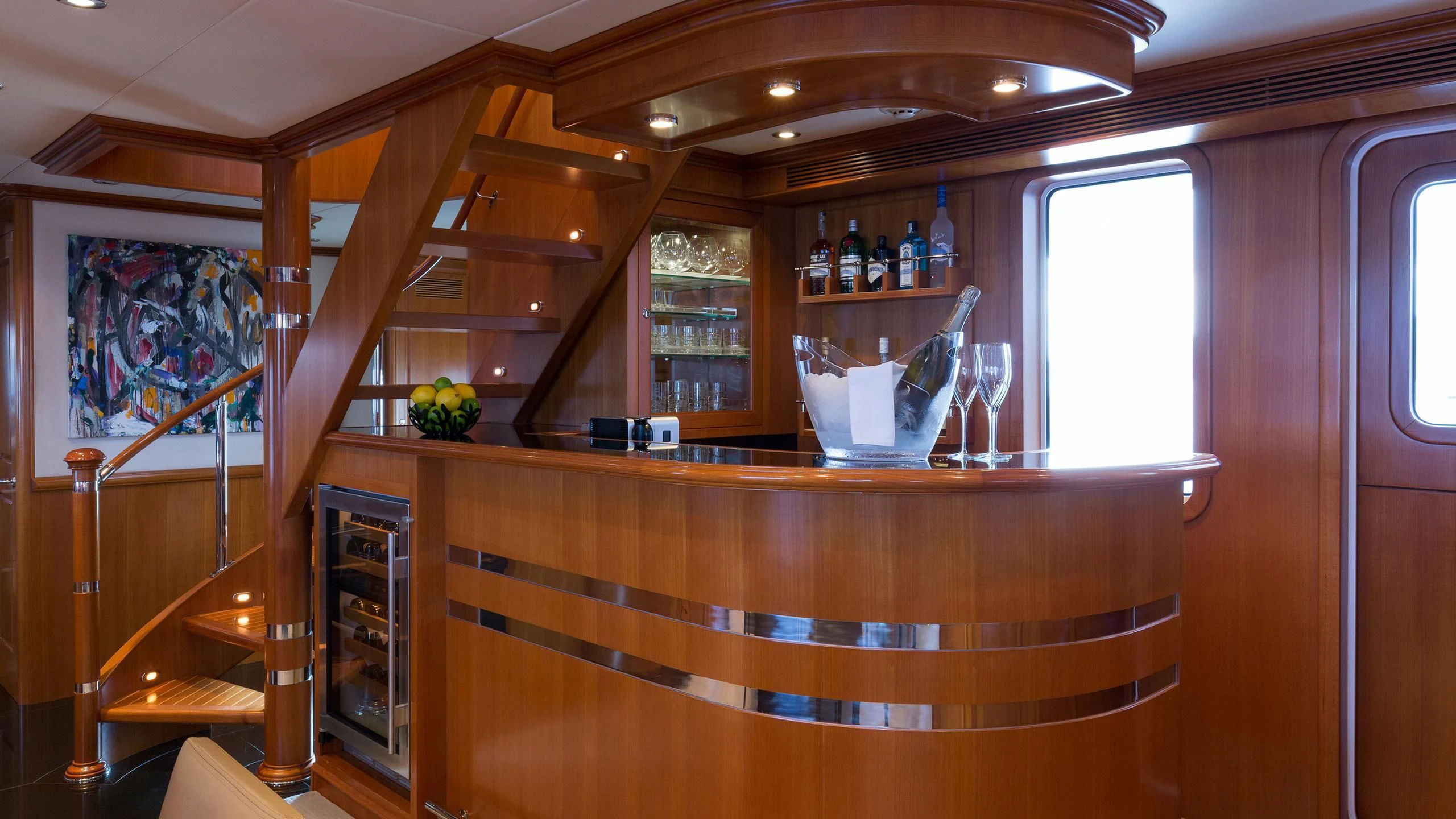 a bar with a glass display aboard SOLACE Yacht for Sale