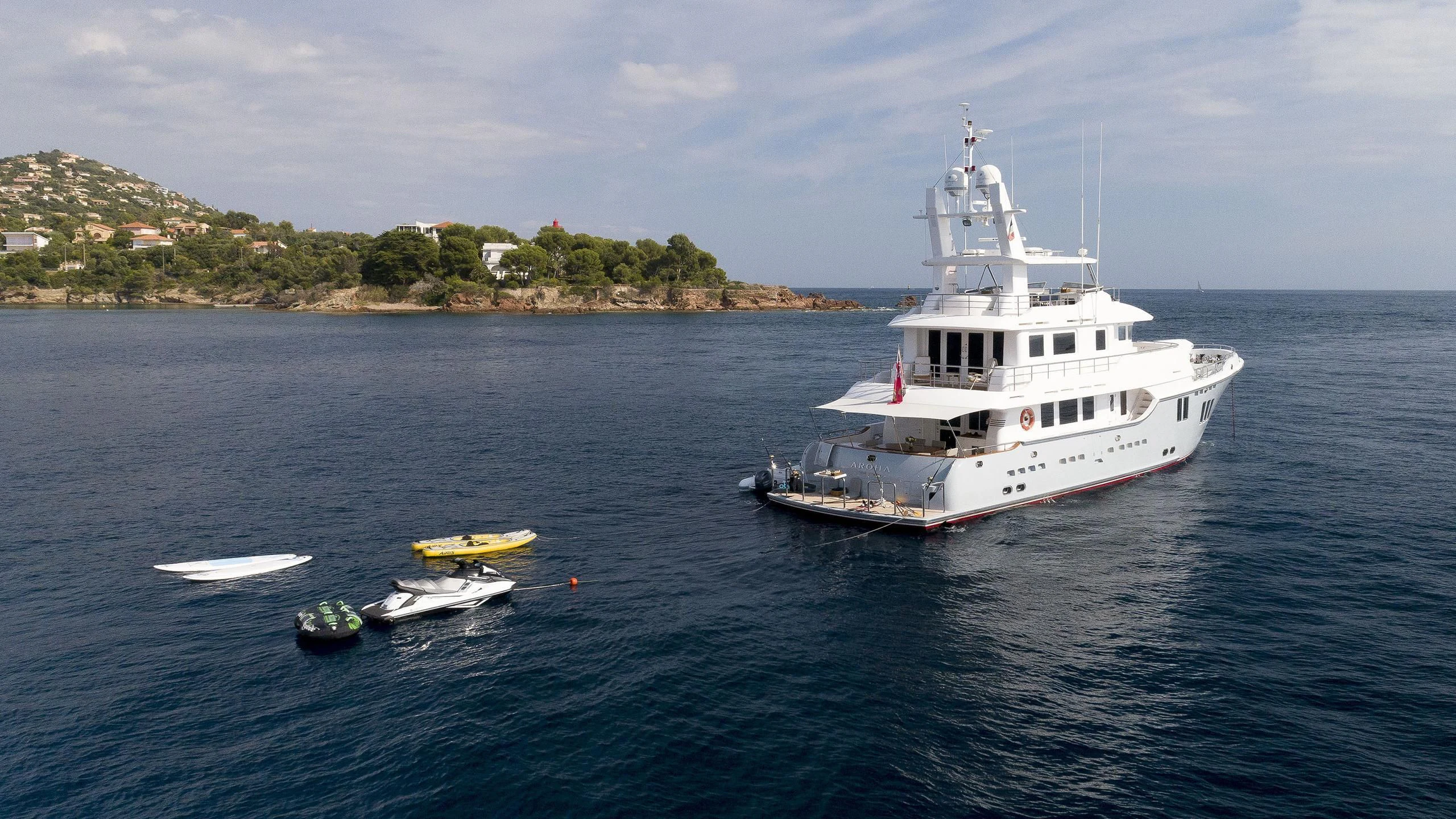 a boat and a couple of boats in the water aboard SOLACE Yacht for Sale