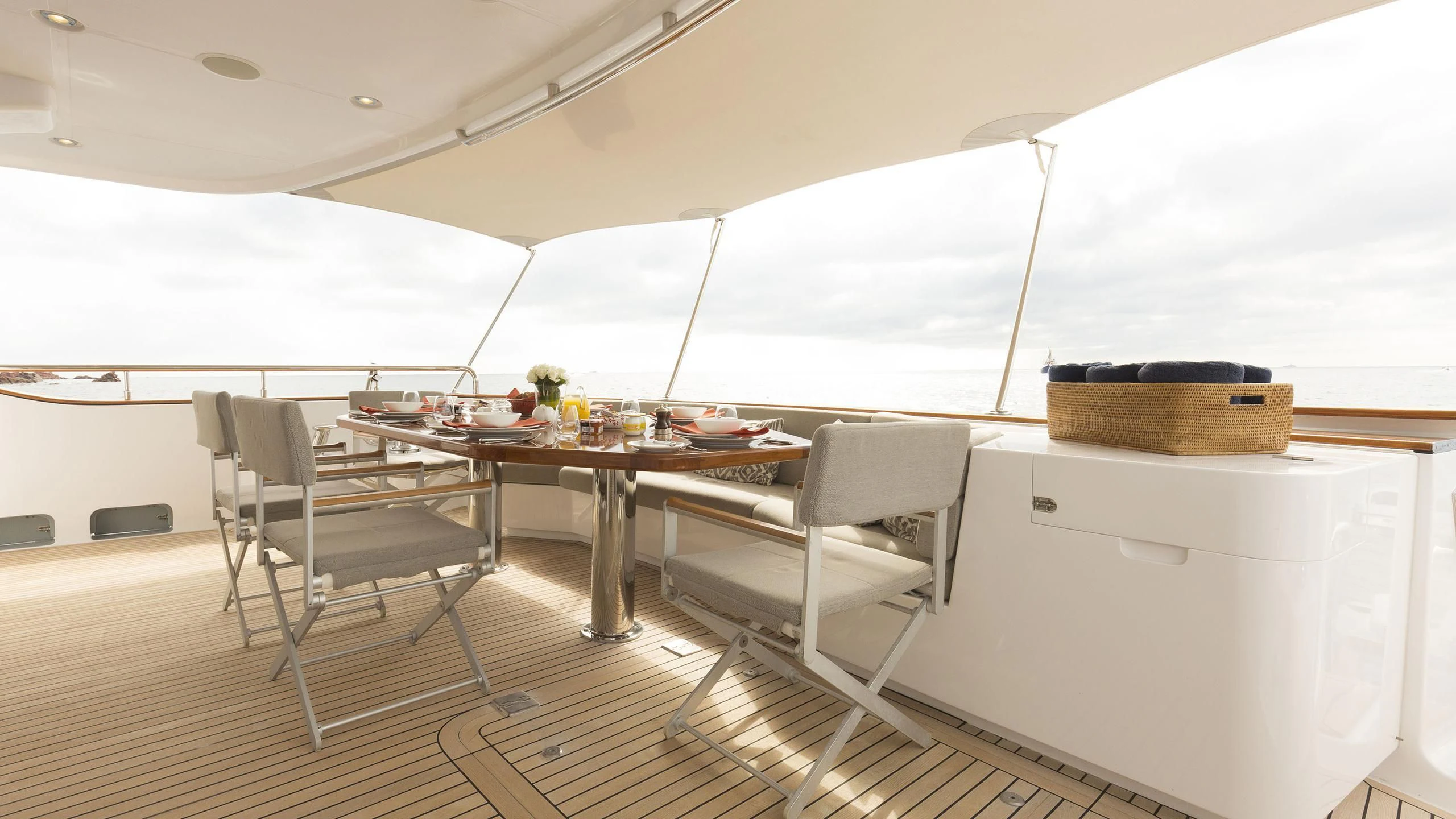 a room with a table and chairs aboard SOLACE Yacht for Sale
