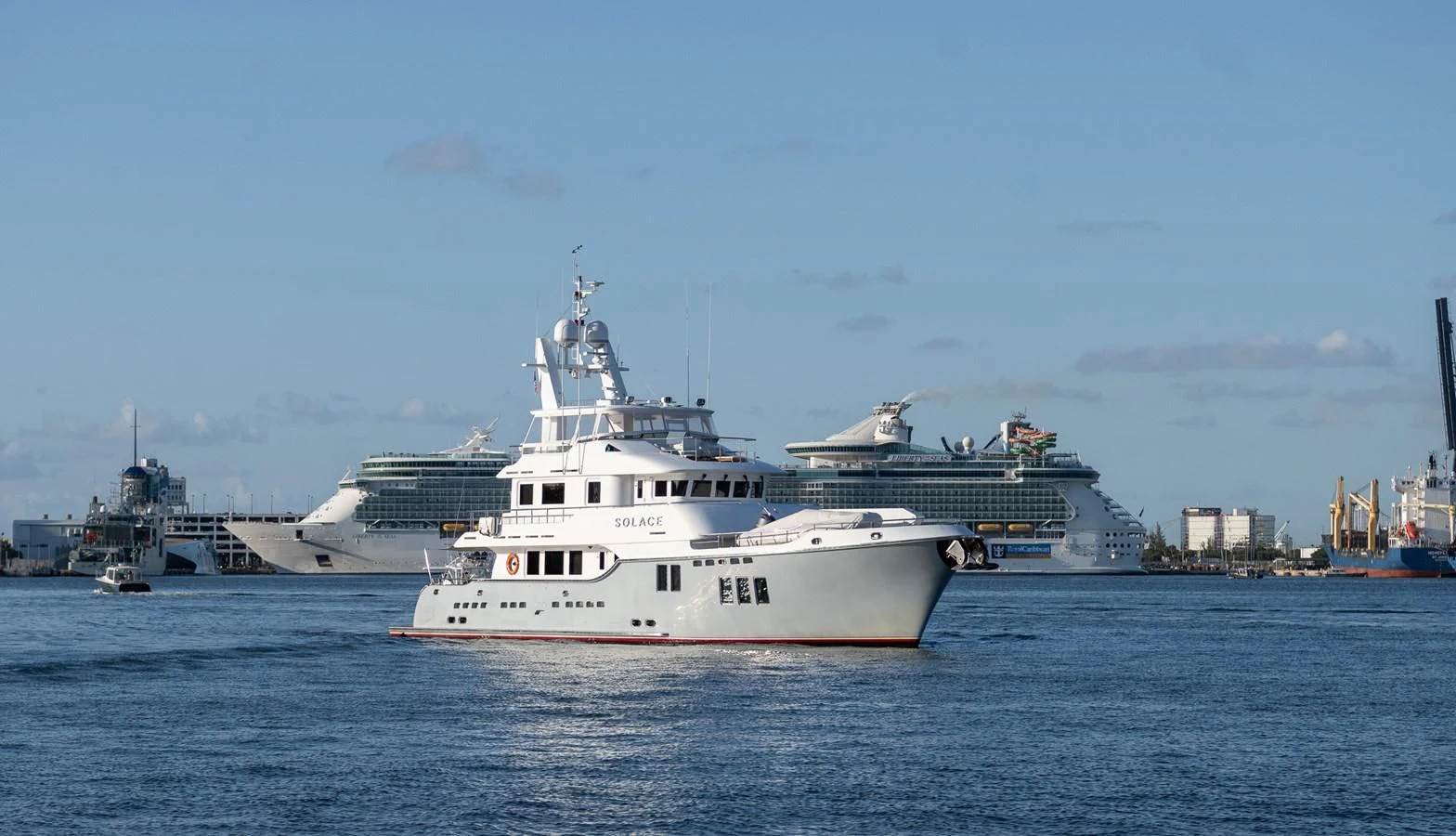 a large white boat in the water aboard SOLACE Yacht for Sale
