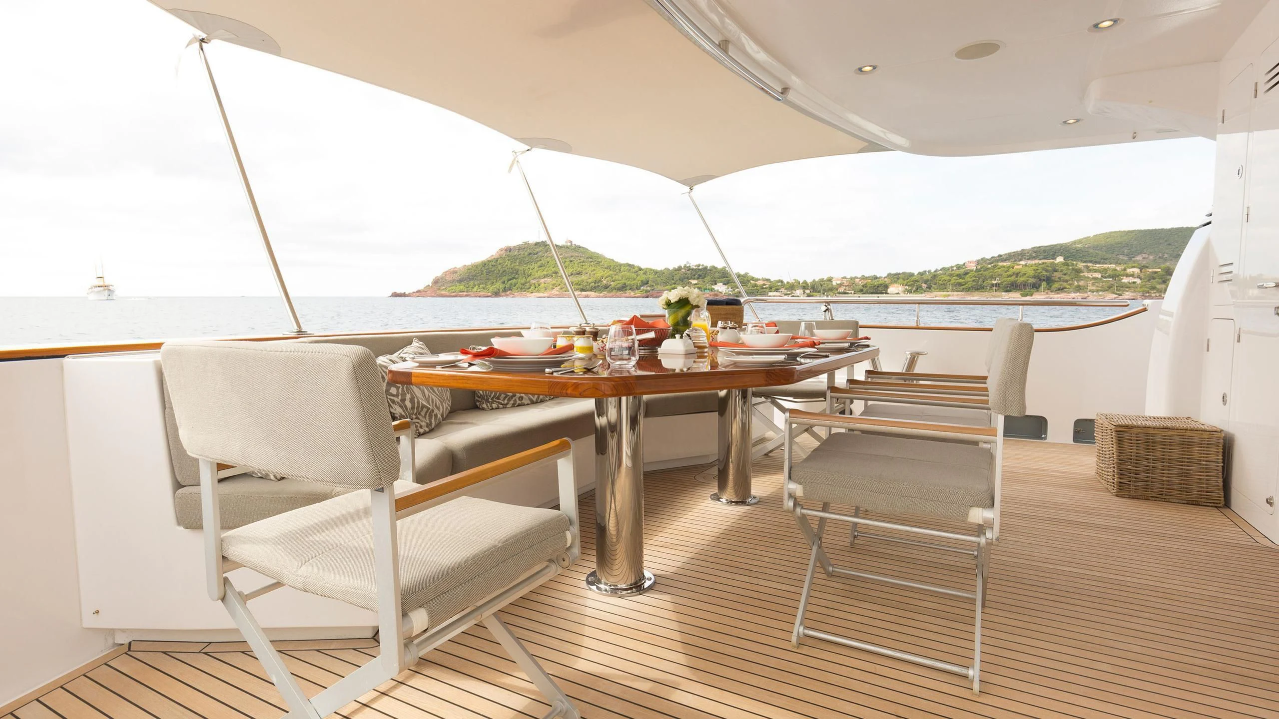 a table and chairs on a deck aboard SOLACE Yacht for Sale