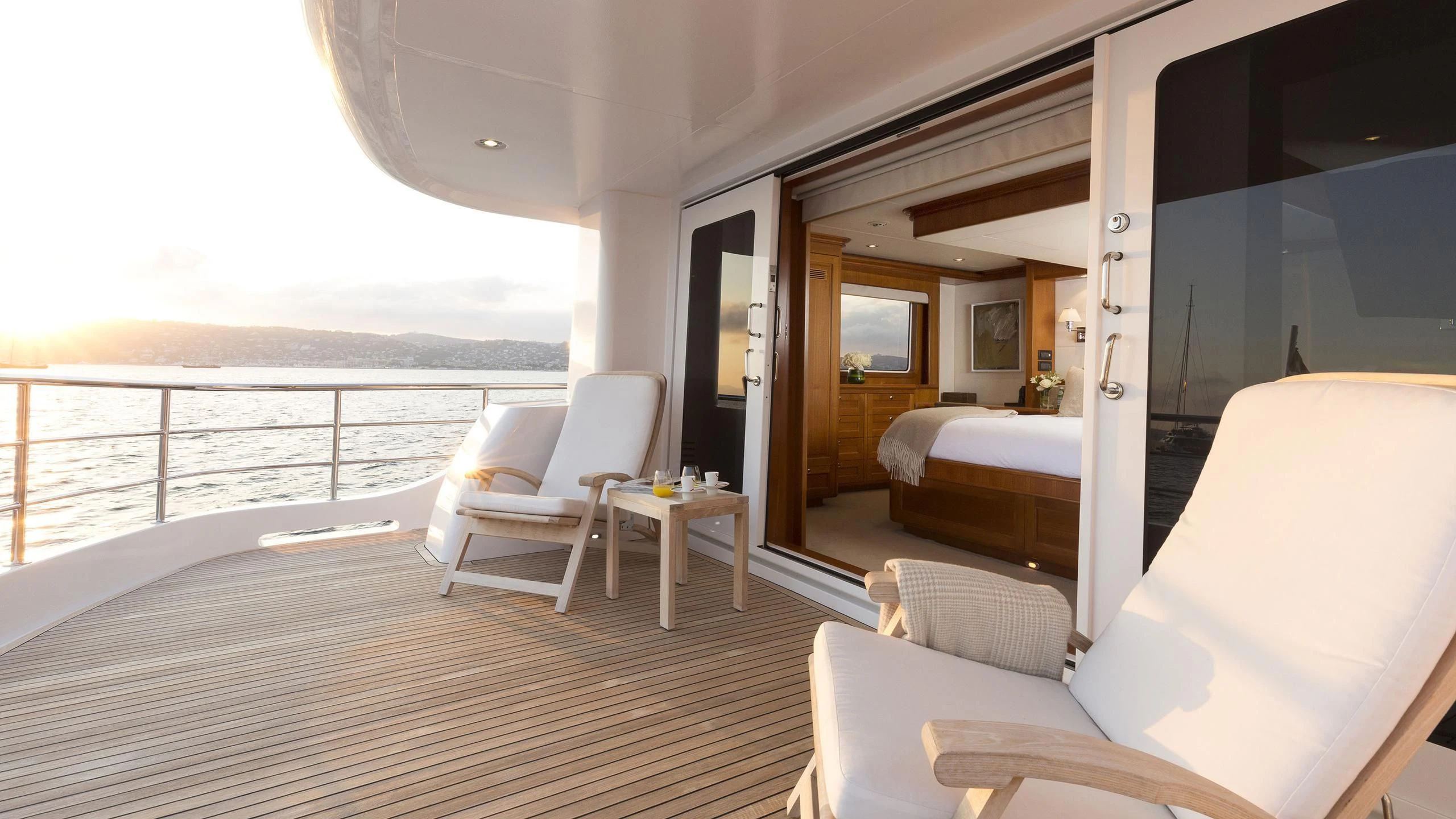a room with a bed and a chair aboard SOLACE Yacht for Sale