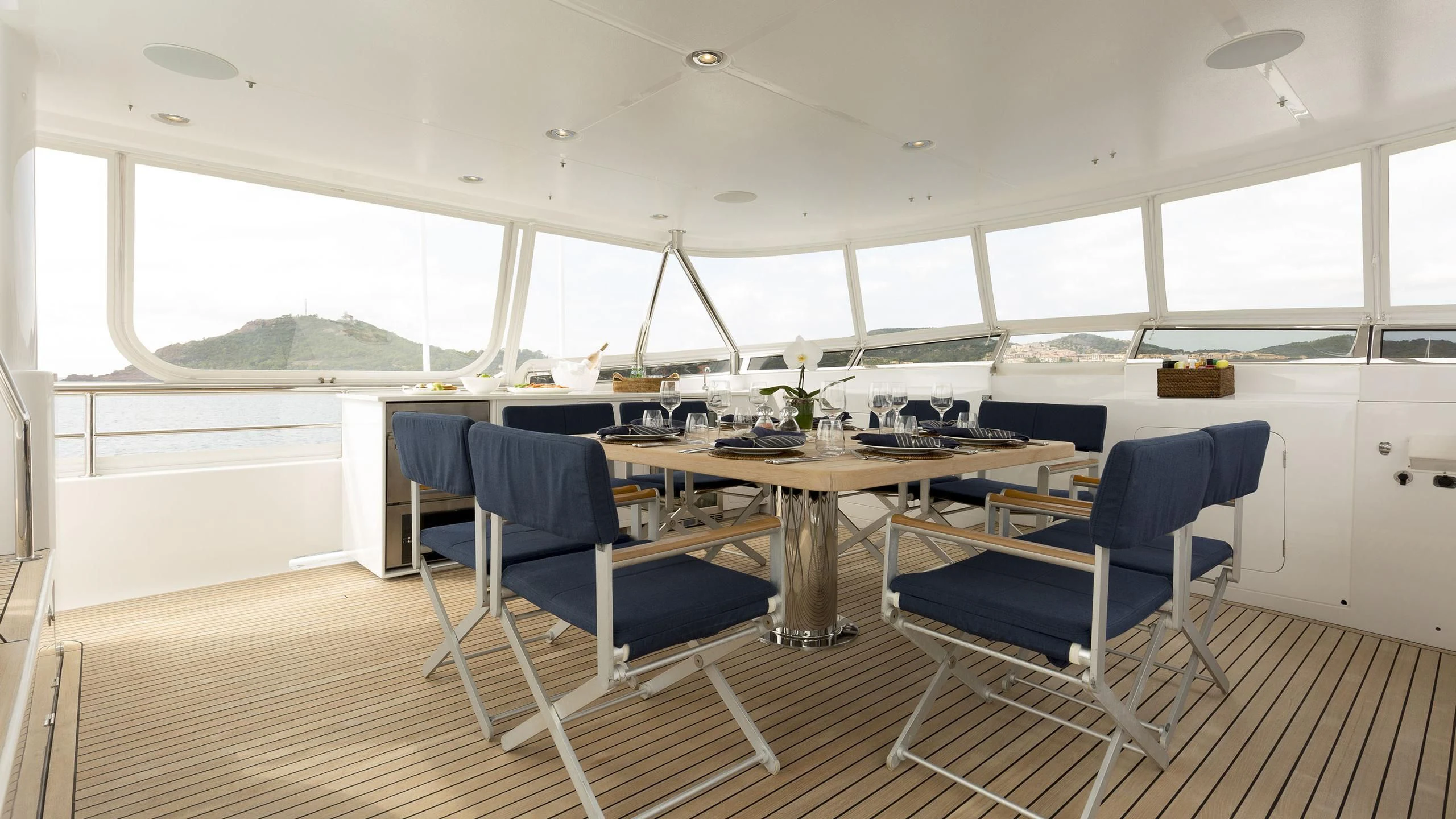 a room with a table and chairs aboard SOLACE Yacht for Sale
