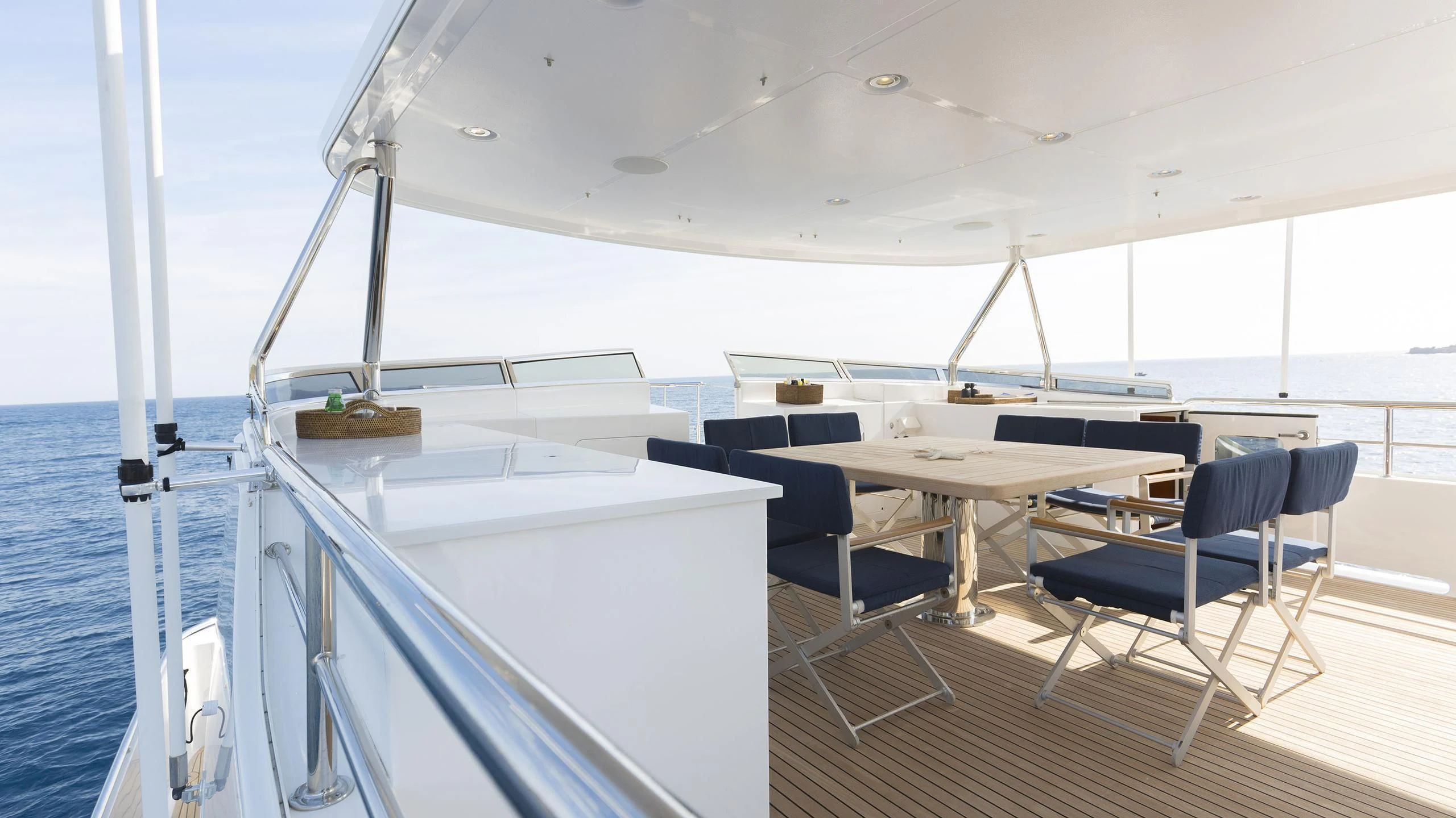 a boat with tables and chairs aboard SOLACE Yacht for Sale