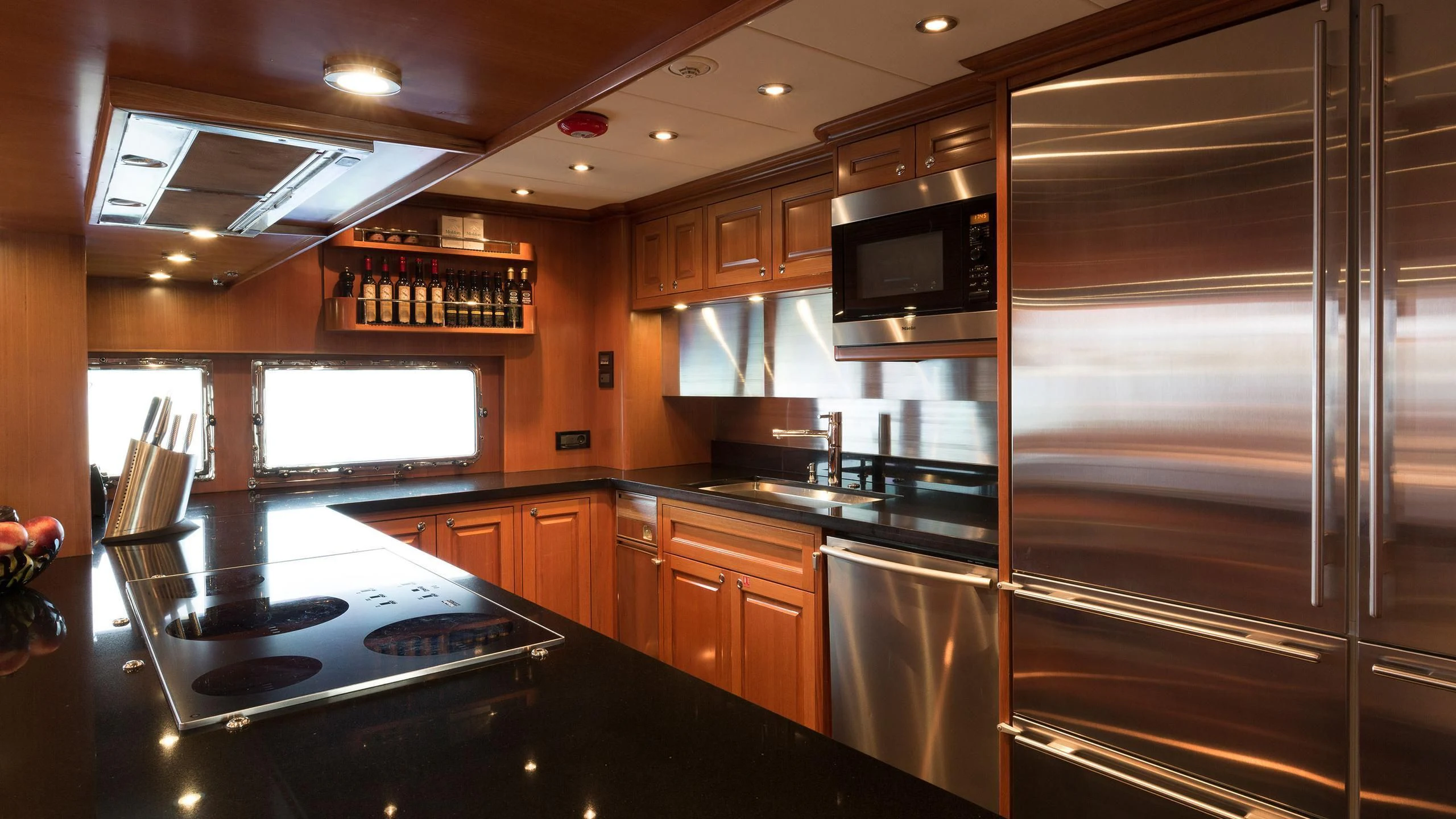 a kitchen with a large glass shower aboard SOLACE Yacht for Sale