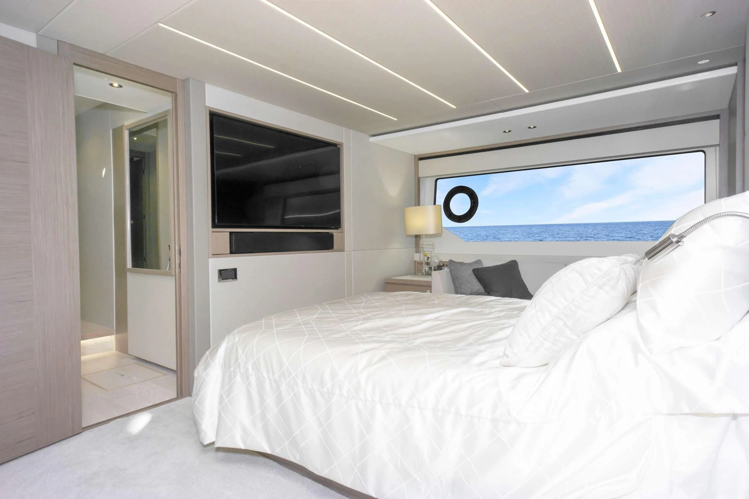 a bedroom with a large bed aboard MILAMO Yacht for Sale