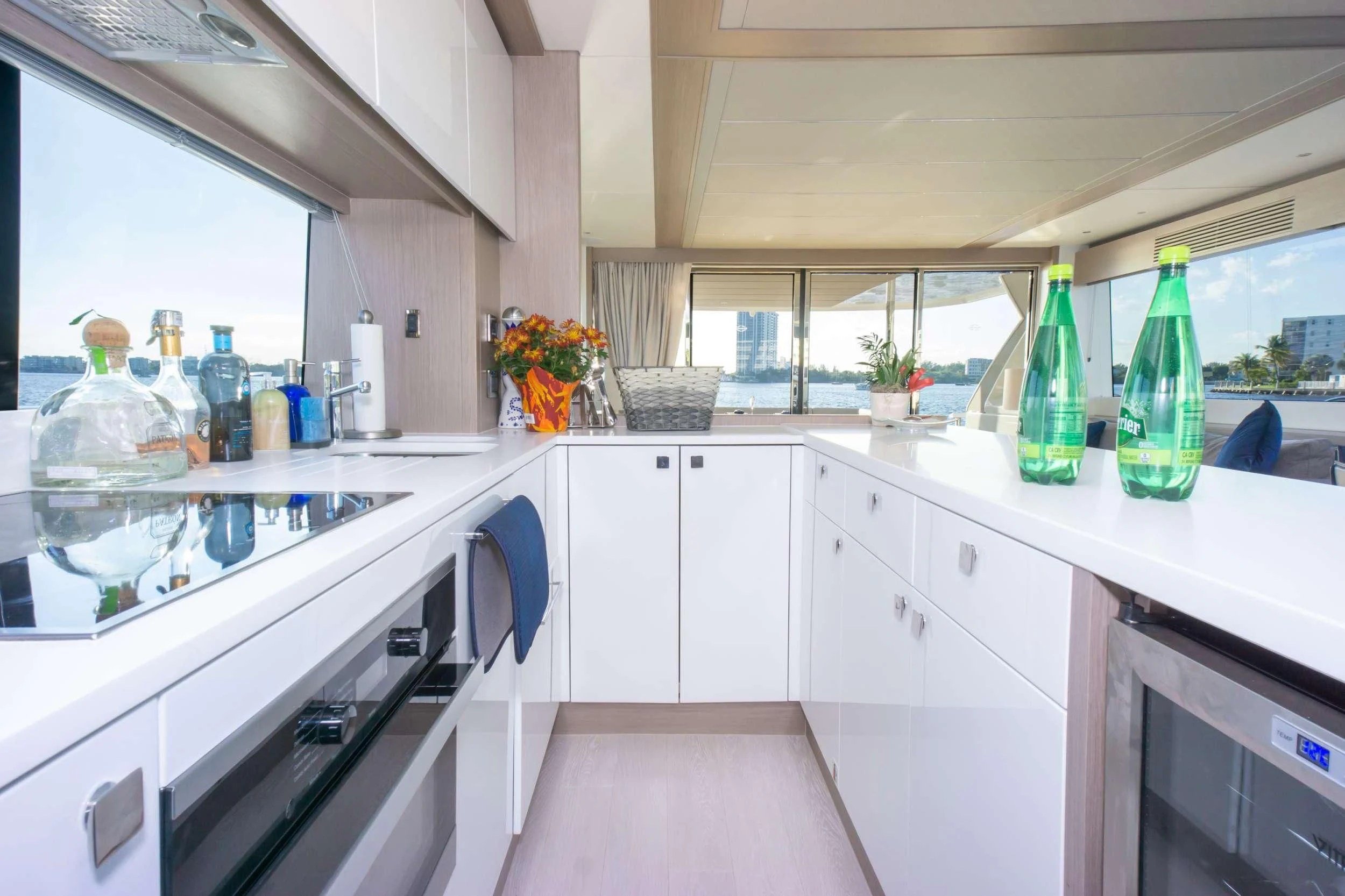 a kitchen with white cabinets aboard MILAMO Yacht for Sale