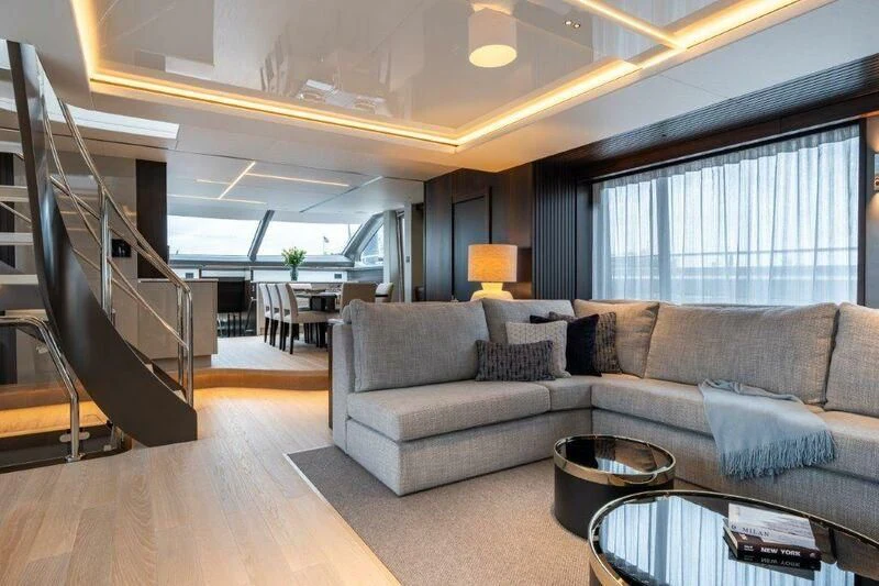 a living room with a large window aboard WORTH THE WAIT Yacht for Sale
