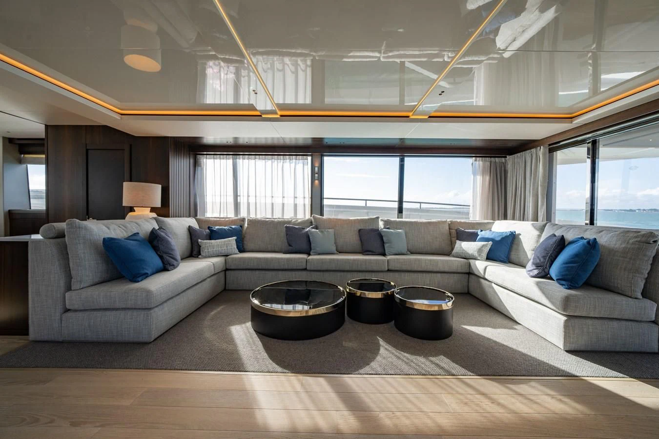 a living room with a couch and a table aboard WORTH THE WAIT Yacht for Sale