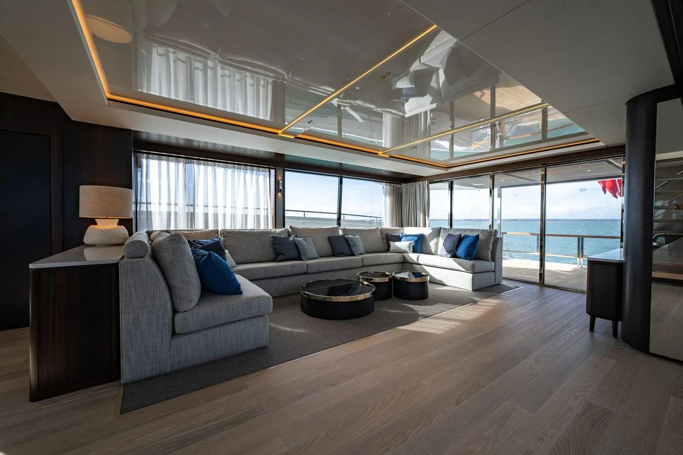 a living room with a large window aboard WORTH THE WAIT Yacht for Sale