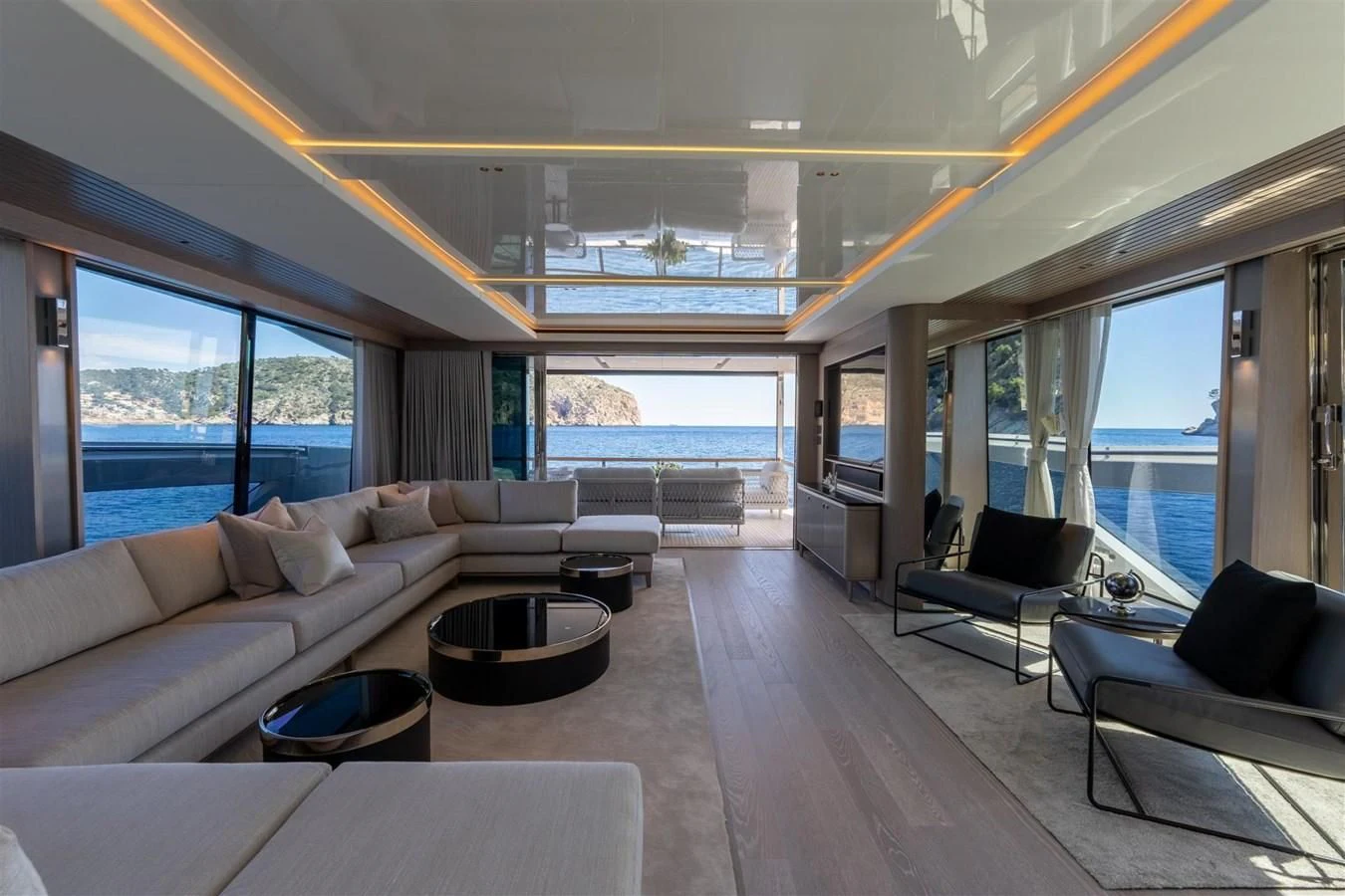 a living room with a large window aboard WORTH THE WAIT Yacht for Sale