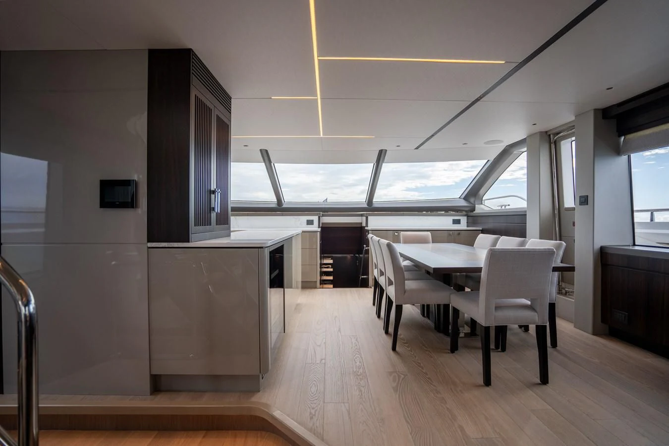 a room with tables and chairs aboard WORTH THE WAIT Yacht for Sale