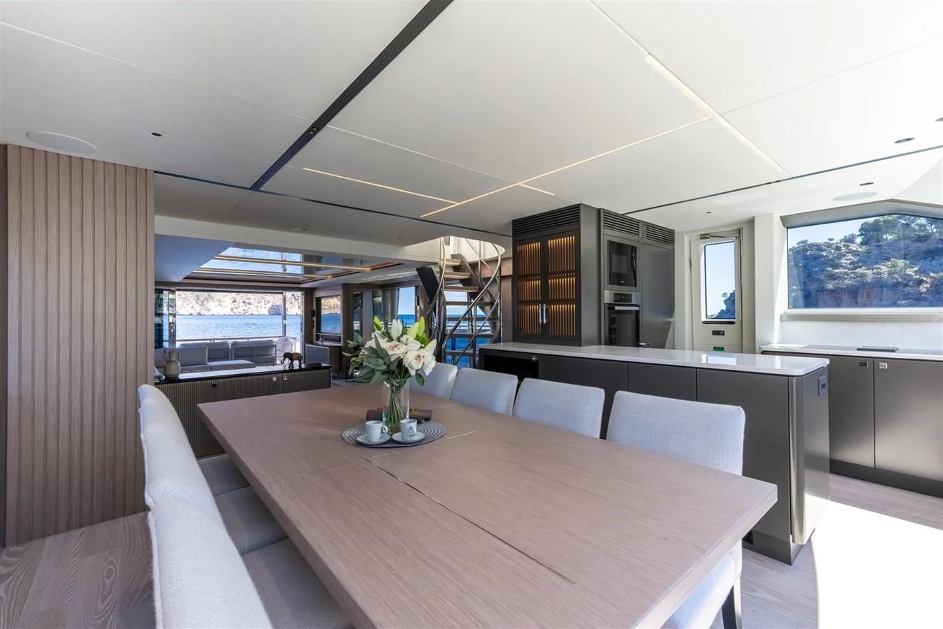 a large room with a table and chairs aboard WORTH THE WAIT Yacht for Sale