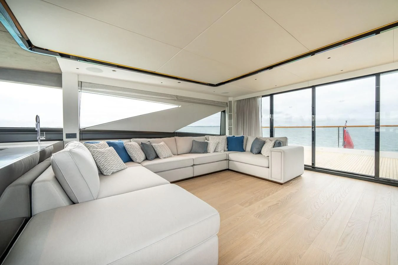 a living room with a large window aboard WORTH THE WAIT Yacht for Sale