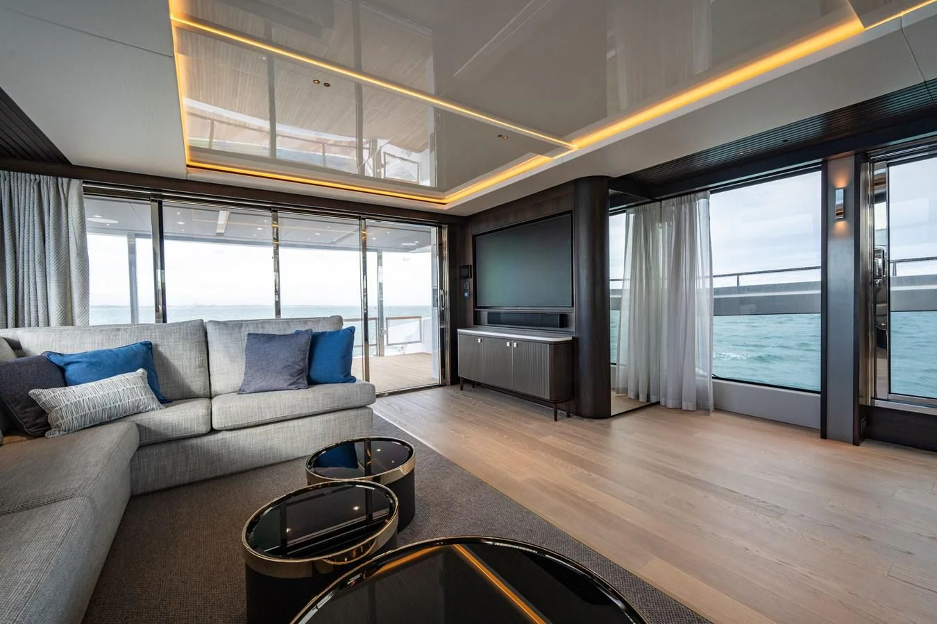 a living room with a large window aboard WORTH THE WAIT Yacht for Sale