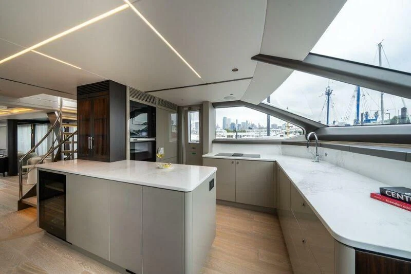 a kitchen with a large island aboard WORTH THE WAIT Yacht for Sale