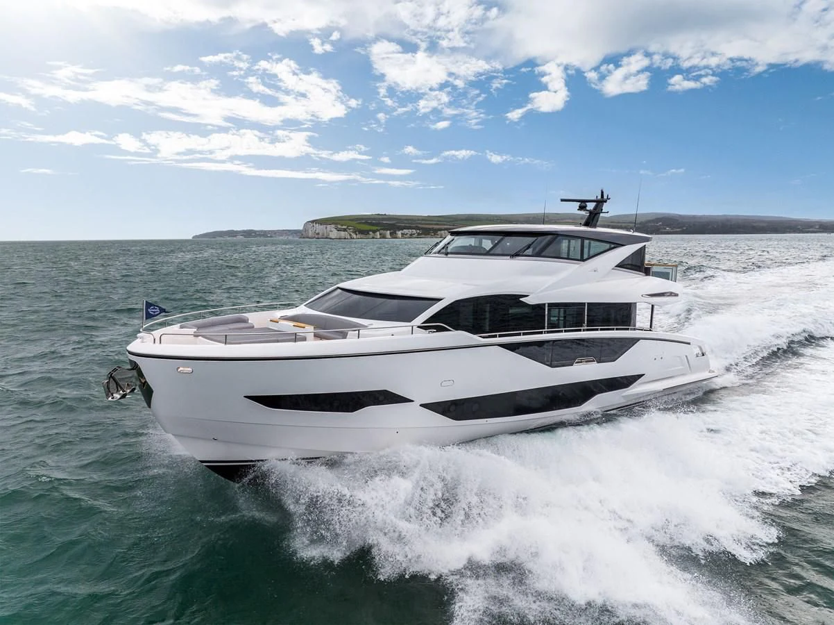 a white yacht on the water aboard WORTH THE WAIT Yacht for Sale
