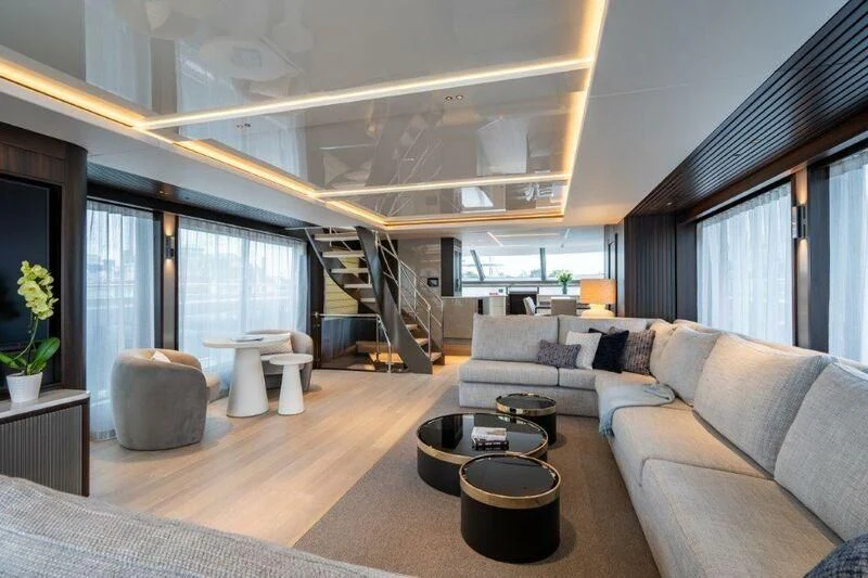 a living room with a staircase aboard WORTH THE WAIT Yacht for Sale