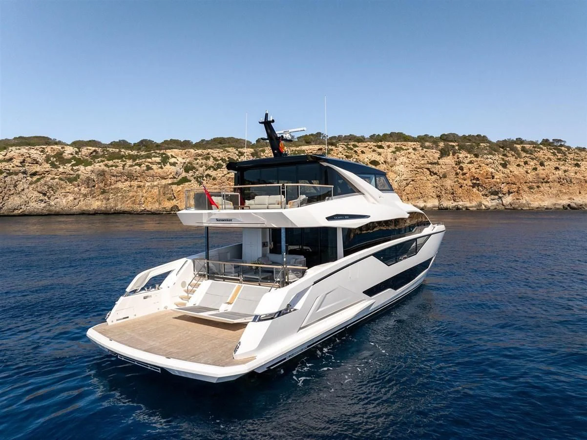 a white boat in the water aboard WORTH THE WAIT Yacht for Sale
