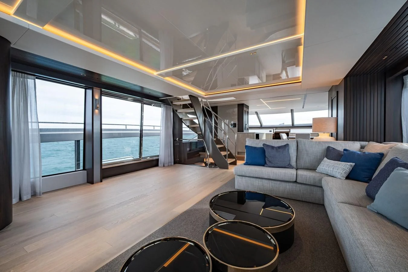 a living room with a large window aboard WORTH THE WAIT Yacht for Sale