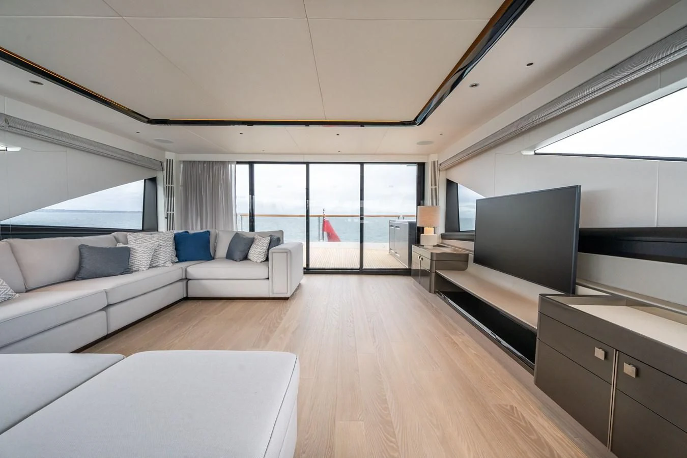 a living room with a large window aboard WORTH THE WAIT Yacht for Sale