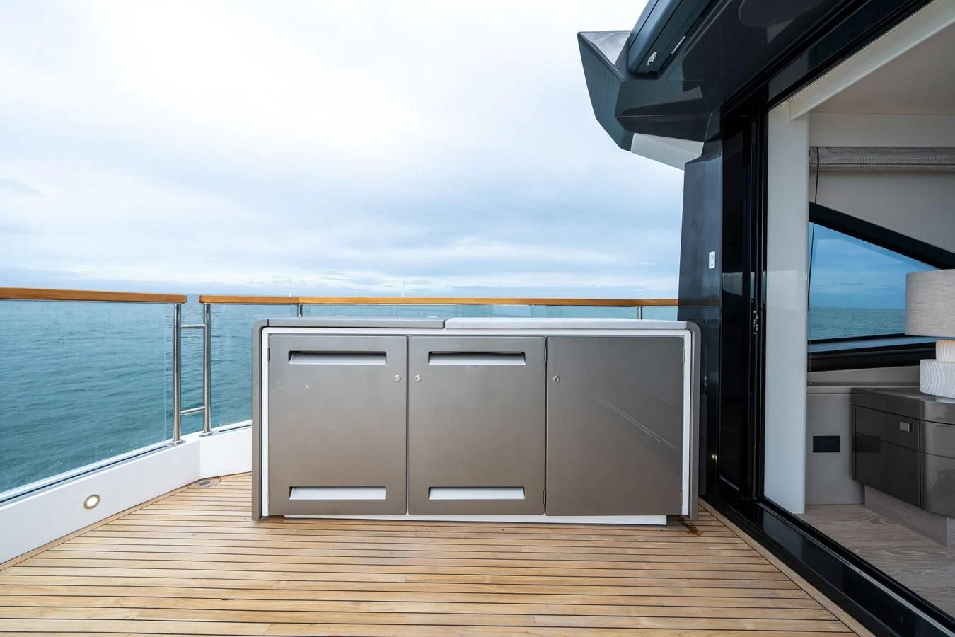 a room with a large window and a wood floor aboard WORTH THE WAIT Yacht for Sale