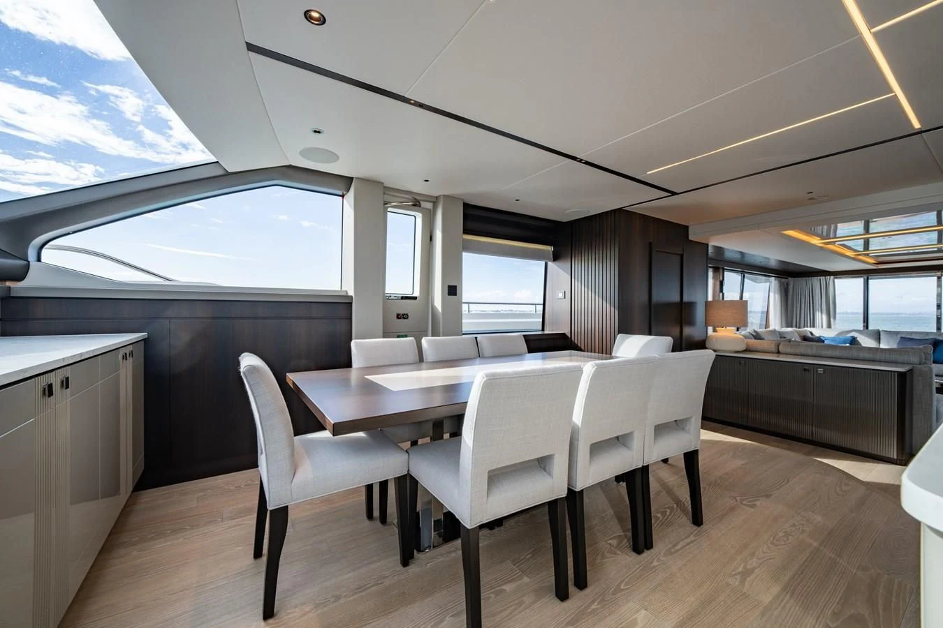 a room with a table and chairs aboard WORTH THE WAIT Yacht for Sale