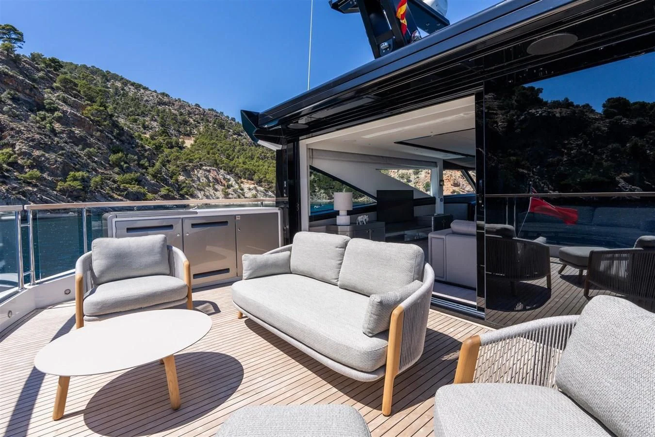 a living room with a view of a mountain range aboard WORTH THE WAIT Yacht for Sale