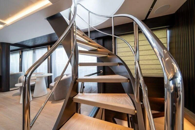 a staircase with a glass window aboard WORTH THE WAIT Yacht for Sale