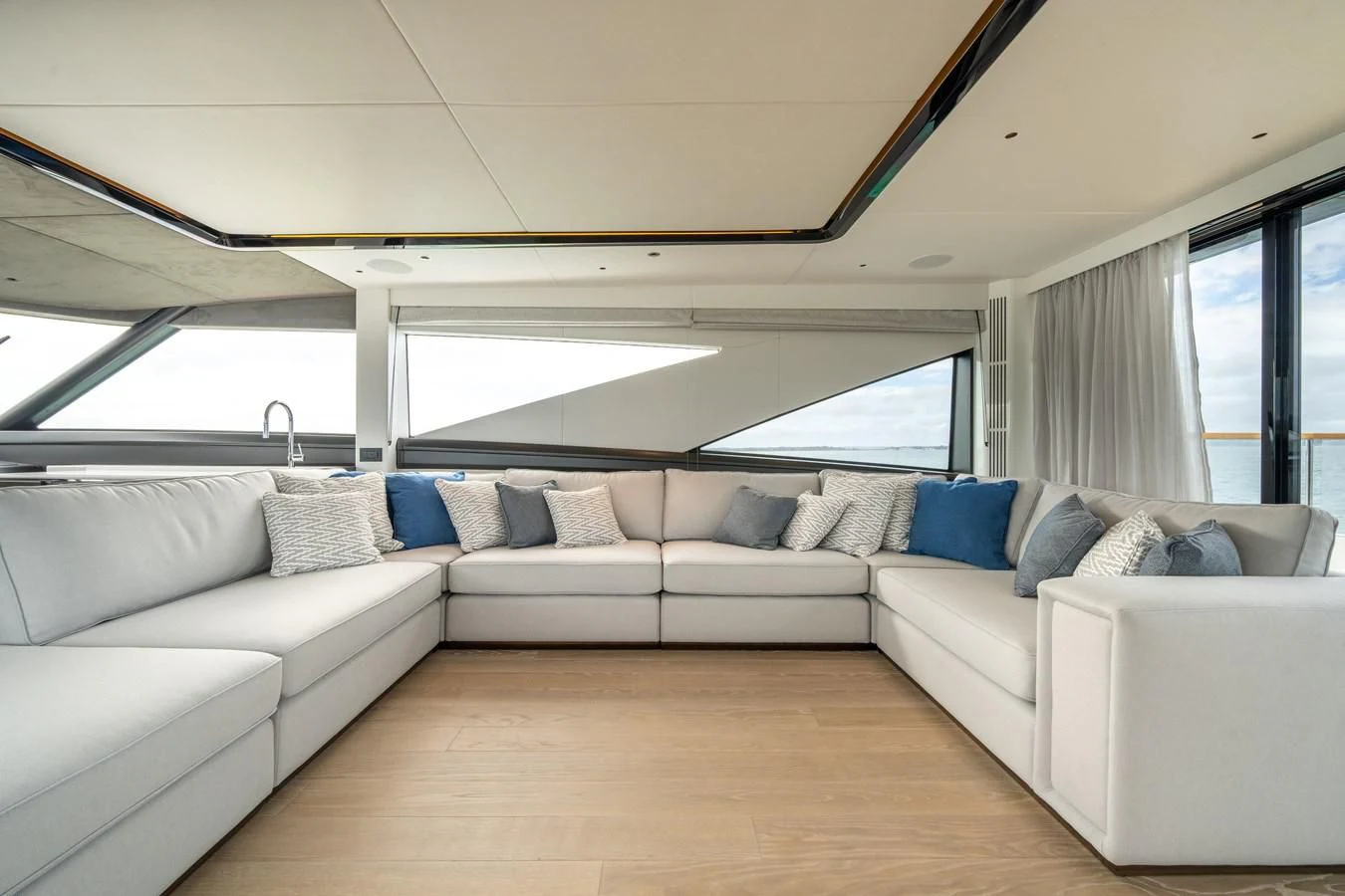 a white couch in a room aboard WORTH THE WAIT Yacht for Sale