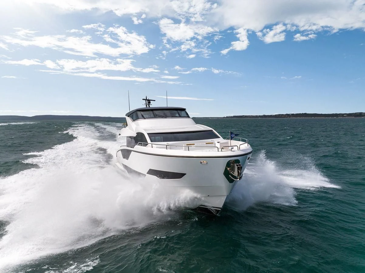 a white boat on water aboard WORTH THE WAIT Yacht for Sale