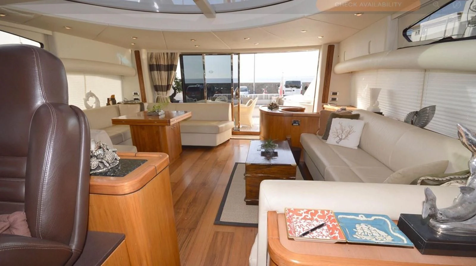 a living room with a couch and a table aboard VA VA VROOM Yacht for Sale
