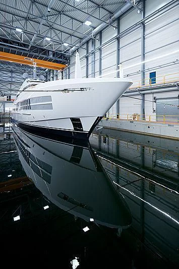 a boat in a large warehouse aboard JUNO Yacht for Sale
