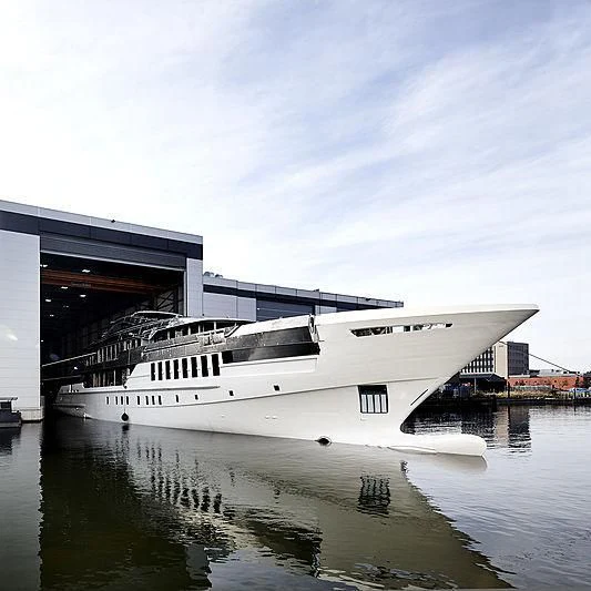a large white boat in a body of water aboard JUNO Yacht for Sale