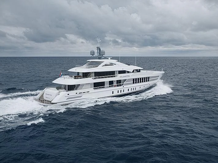 a white boat on the water aboard JUNO Yacht for Sale