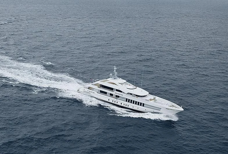 a white boat in the water aboard JUNO Yacht for Sale